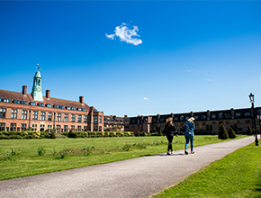 students walking though campus